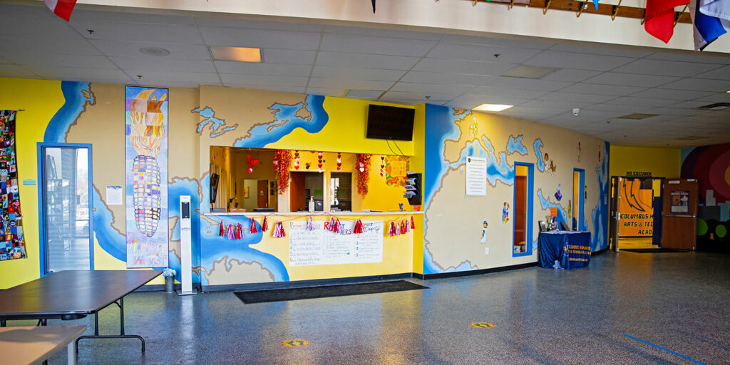 Bright entryway with murals at CHATA.